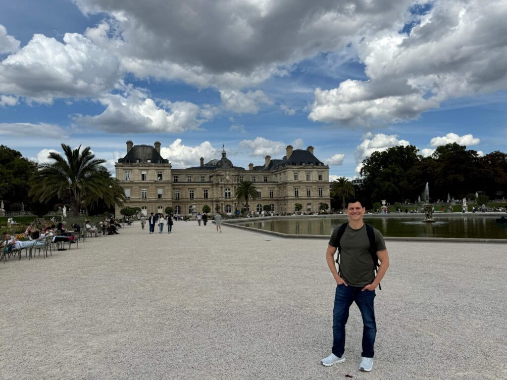 nomadic matt in front of the luxembourg gardens